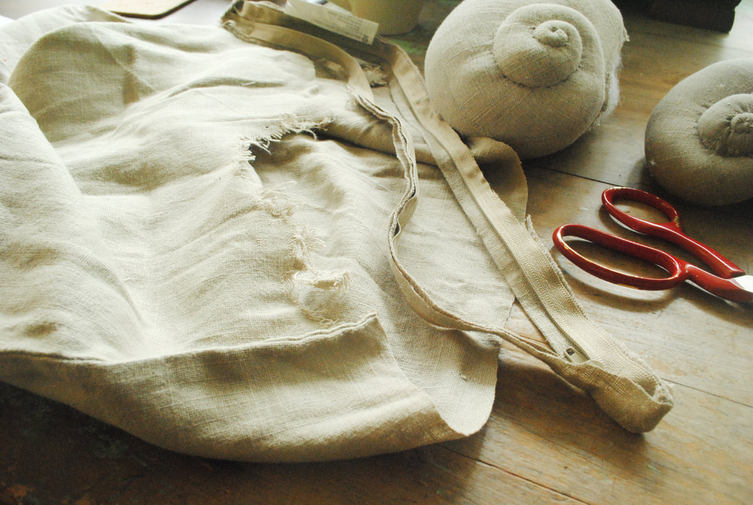 Upcycled linen used to sew snail shells, by Willowynn 
